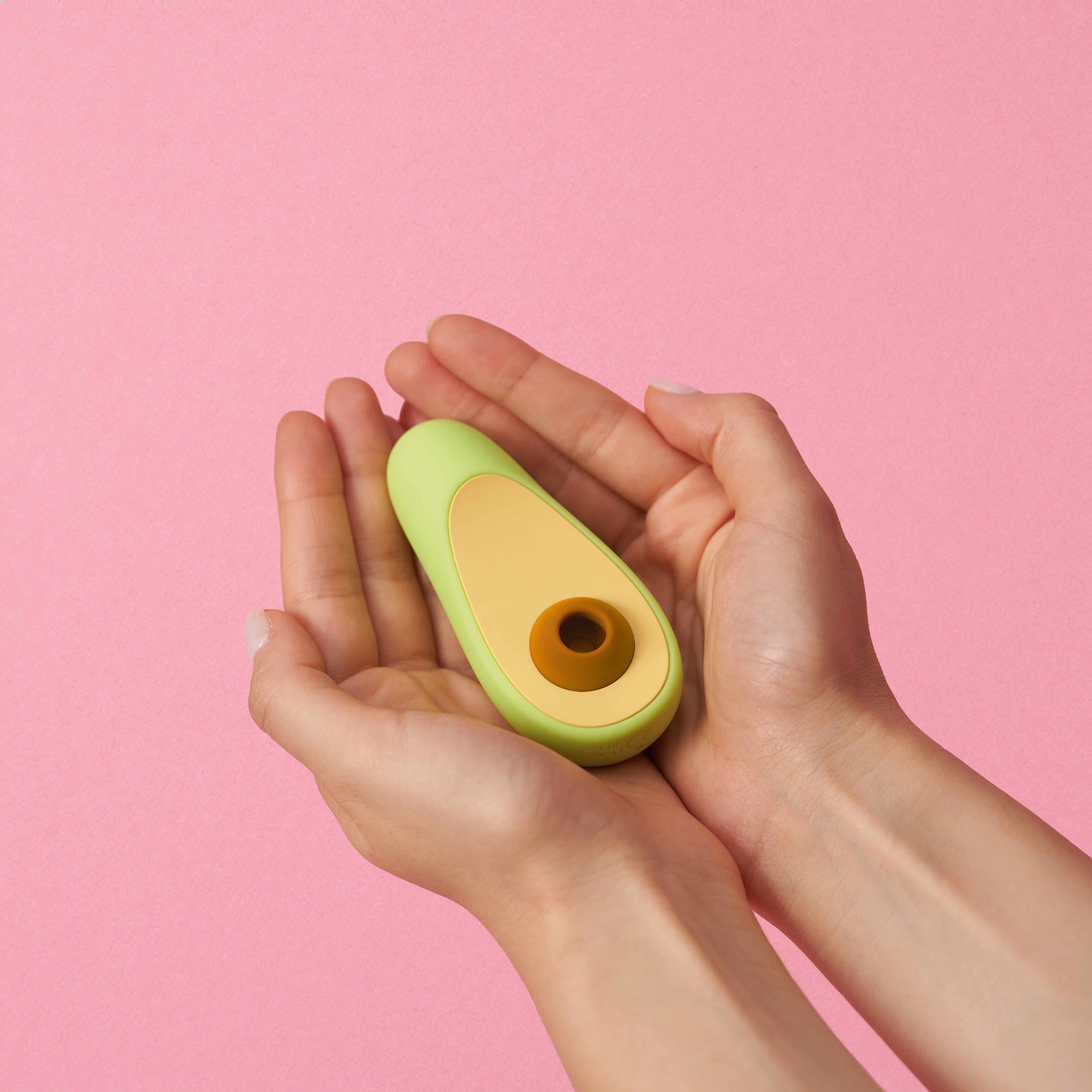 Avocado clitoral vibrator — in hand