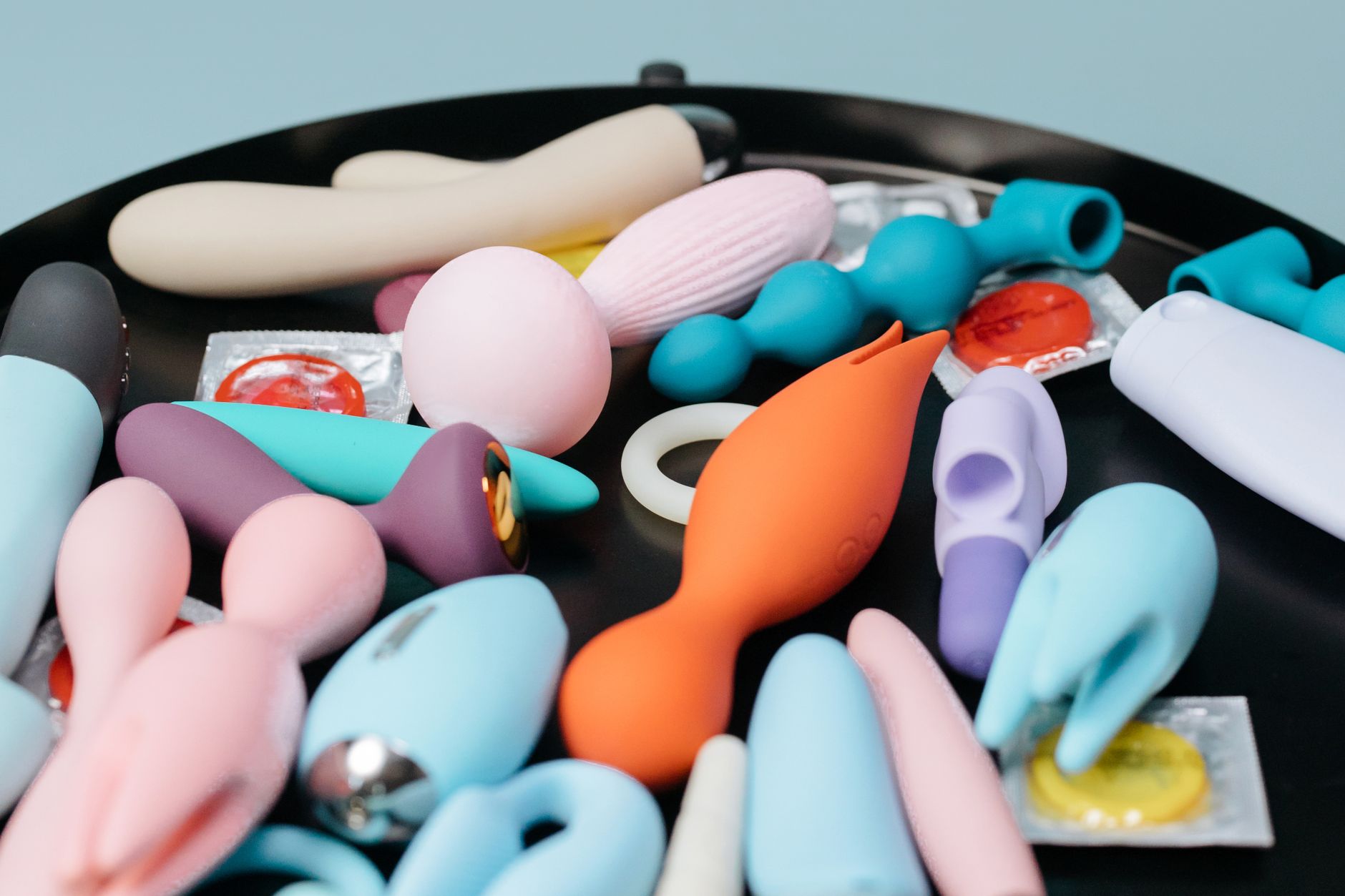 Woman holding silicone vibrators with intention and calm confidence